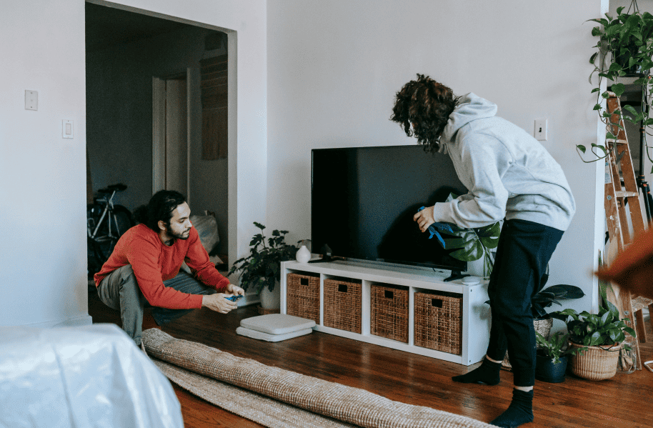 Fragile furniture being carefully moved by professional movers during a residential move.